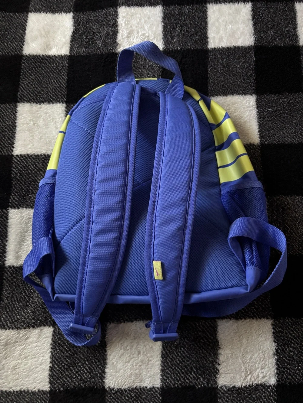 Nike Blue Sling Backpack with Pink Swoosh and Yellow Strap Accent